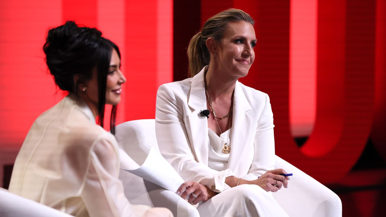 Kim Kardashian and Poppy Harlow speak onstage at the 2023 Time 100 Summit.