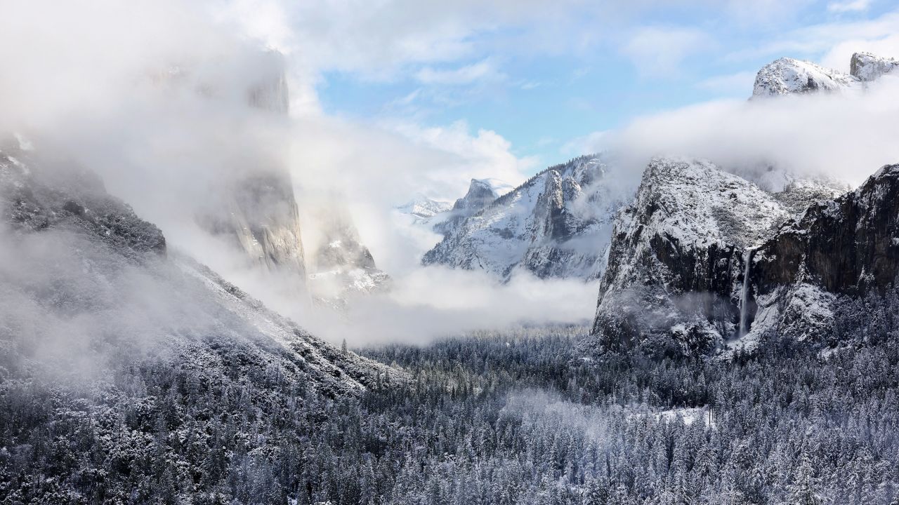 Snowfall rests on trees in Yosemite Valley on January 19, 2023, in Yosemite National Park. The park has gotten a lot more snow to add to its snowpack since then -- as has much of the high elevation in many parts of the state.