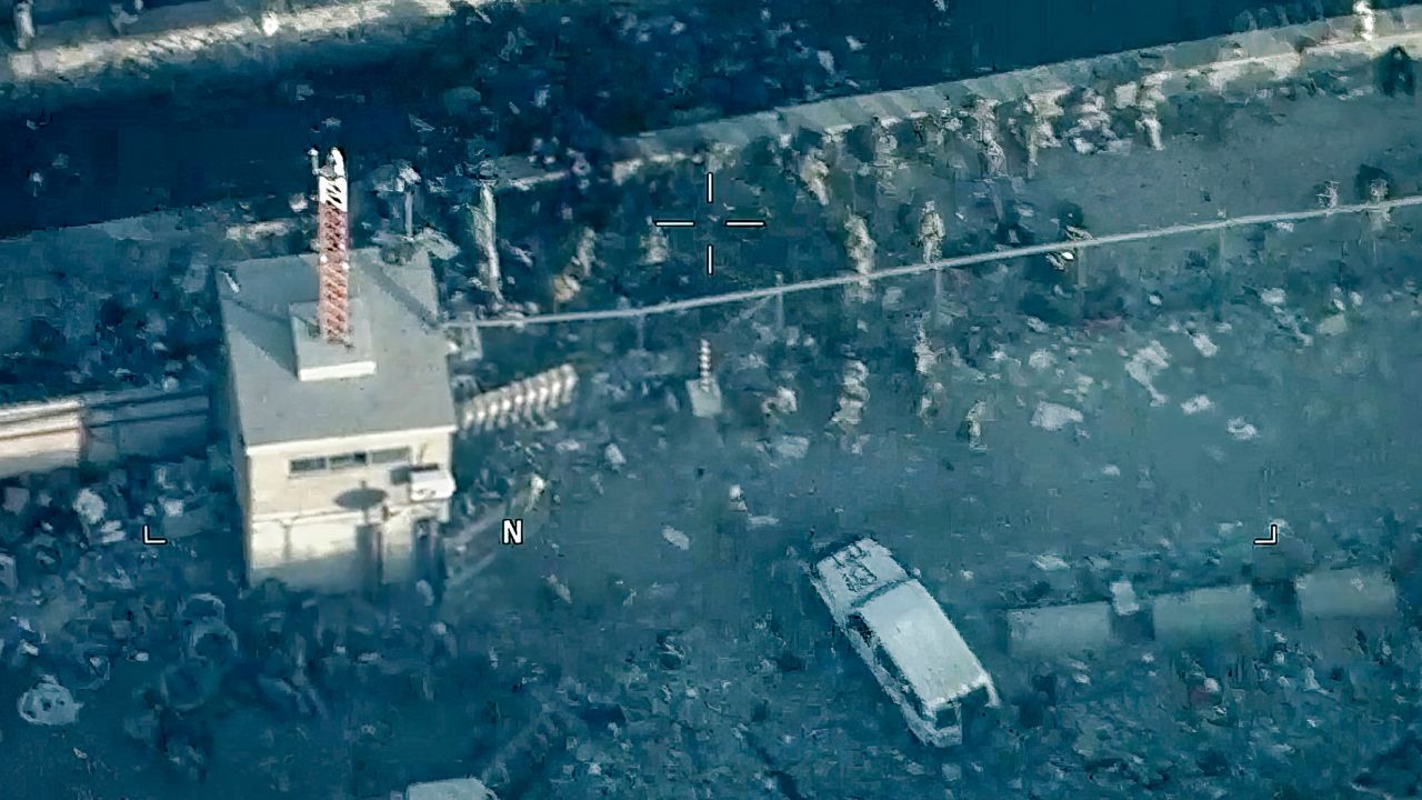 FILE - This image from a video released by the Department of Defense shows U.S. Marines around the scene at Abbey Gate outside Hamid Karzai International Airport on Aug. 26, 2021, in Kabul Afghanistan, after a suicide bomber detonated an explosion.  The Taliban have killed the senior Islamic State group leader behind the August 2021 bombing outside the Kabul airport that killed 13 service members and about 170 Afghans. That is according to the father of a Marine killed in the attack who was briefed on April 25, 2023, by military officials. (Department of Defense via AP, File)