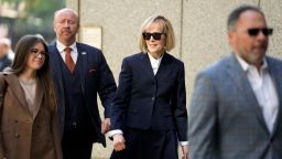 Former advice columnist E. Jean Carroll, second from right, arrives to federal court in New York, Wednesday, April 26.