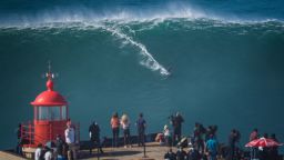 NAZARE, PORTUGAL - 2020/10/29: Big wave surfer Sebastian Steudtner from Germany rides a wave during a tow surfing session at Praia do Norte on the first big swell of winter season. 