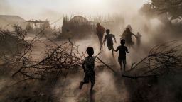TOPSHOT - Children and women run among a cloud of dust at the village of El Gel, 8 kilometres from the town of K'elafo, Ethiopia, on January 12, 2023. - The last five rainy seasons since the end of 2020 have failed, triggering the worst drought in four decades in Ethiopia, Somalia and Kenya. 
And the next rainy season, from March to May, is also expected to be below average. 
According to the UN, drought has plunged 12 million people into "acute food insecurity" in Ethiopia alone, where a deadly conflict has also ravaged the north of the country. (Photo by EDUARDO SOTERAS / AFP) (Photo by EDUARDO SOTERAS/AFP via Getty Images)