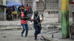 Police officers patrol a neighborhood amid gang-related violence in downtown Port-au-Prince on April 25, 2023. 