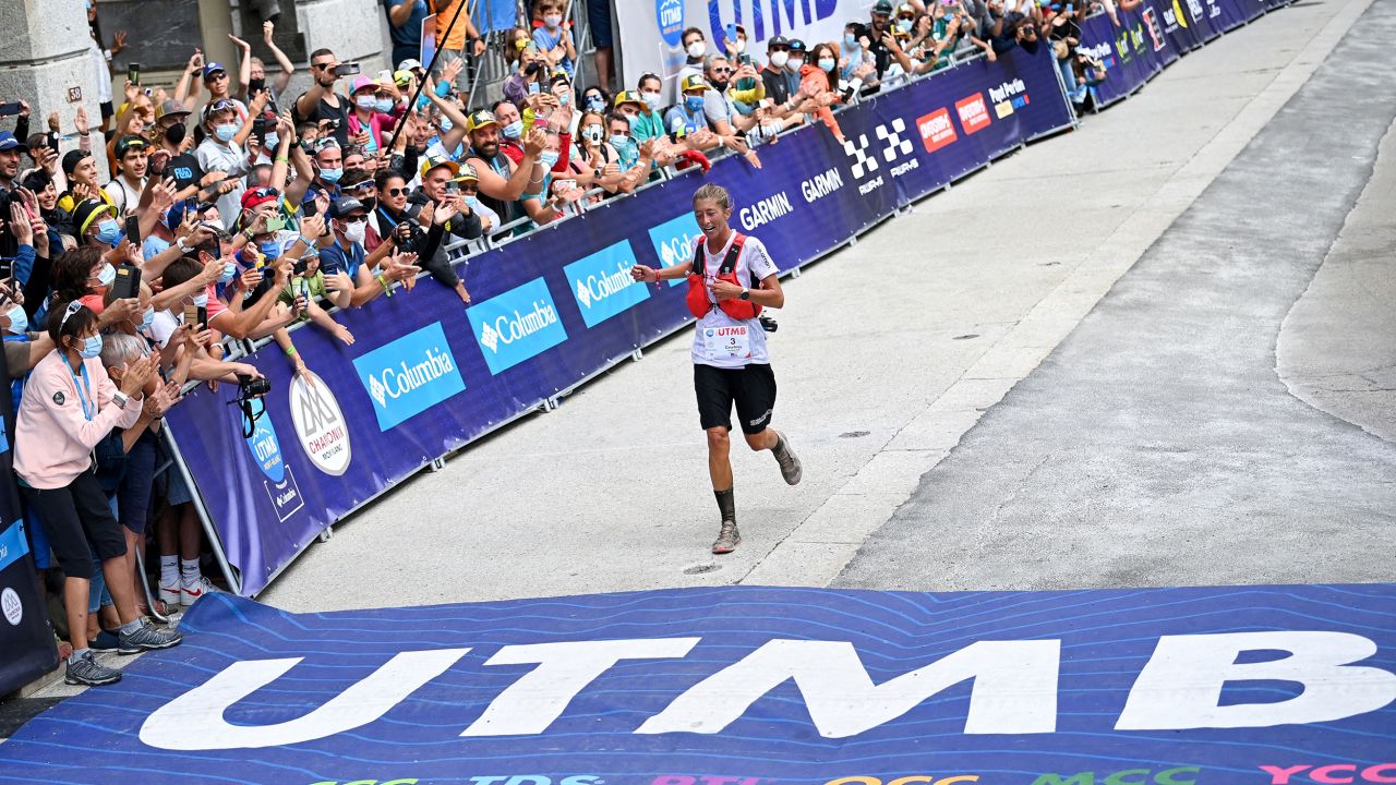 Courtney Dauwalter crosses the finish line for seventh place in the l'Ultra-Trail du Mont-Blanc (UTMB) distance race at Chamonix, eastern France, on August 28, 2021.