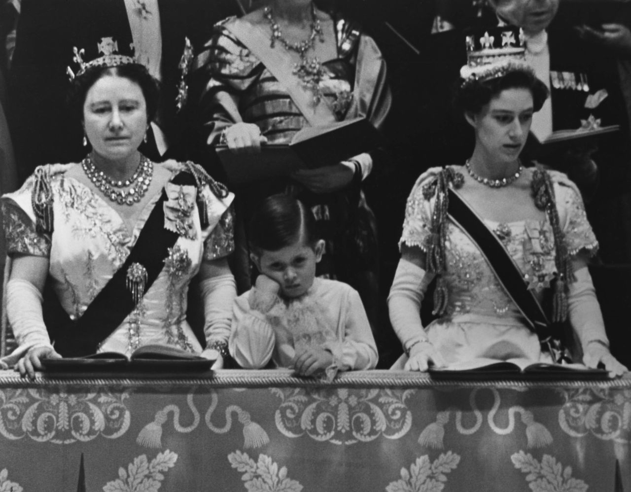 Prince Charles watches his mother's coronation. On the left is his grandmother, the Queen Mother. At right is his aunt, Princess Margaret.