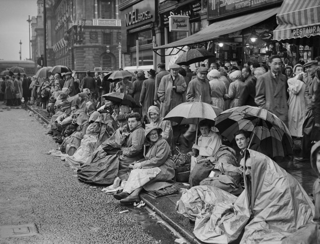 Well-wishers line the procession route in London.