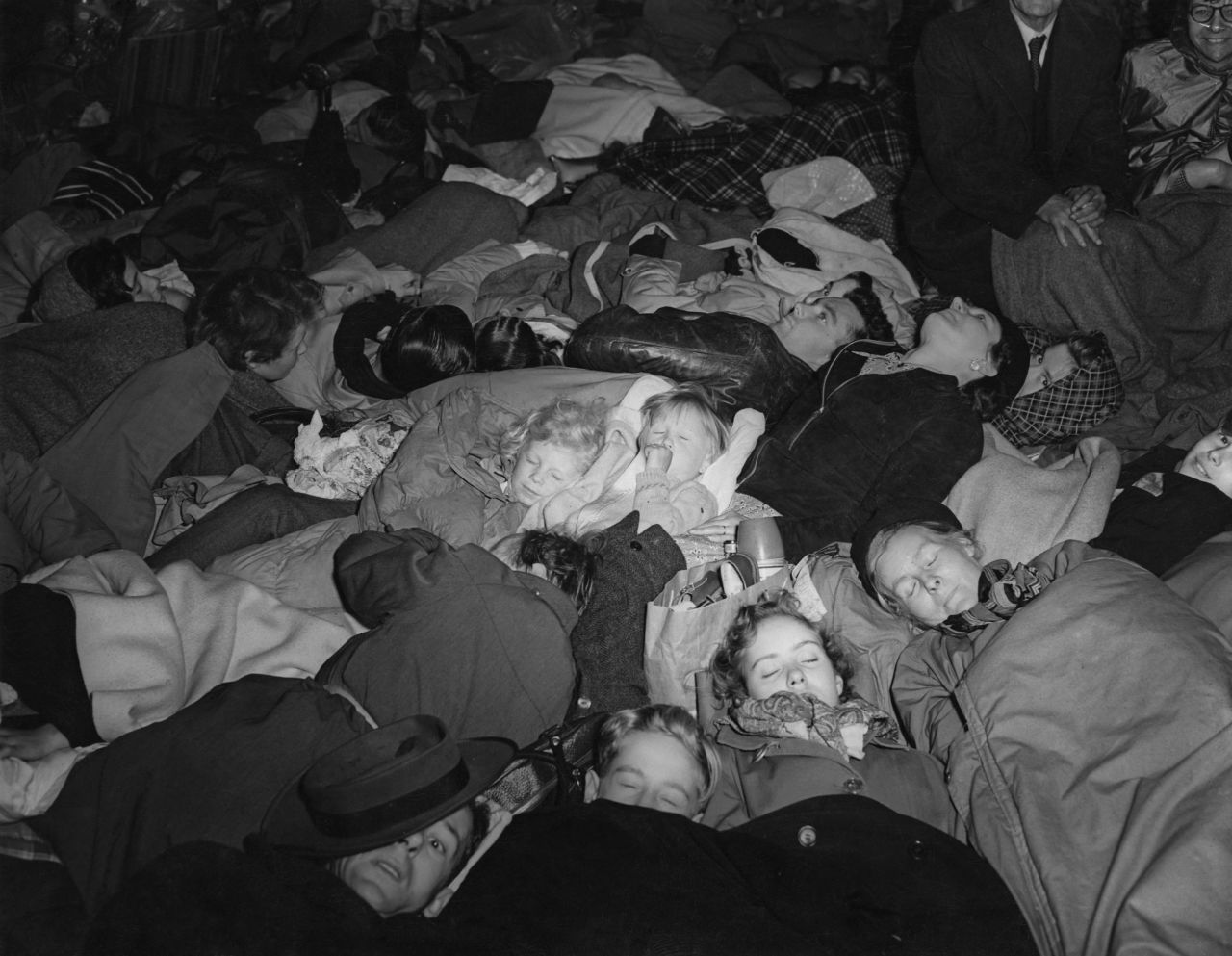 People slept along the procession route on the night before the Queen's coronation.