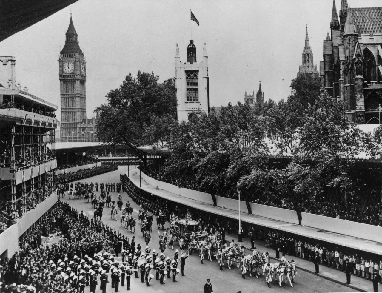 Crowds watch as the procession passes through Parliament Square in London.