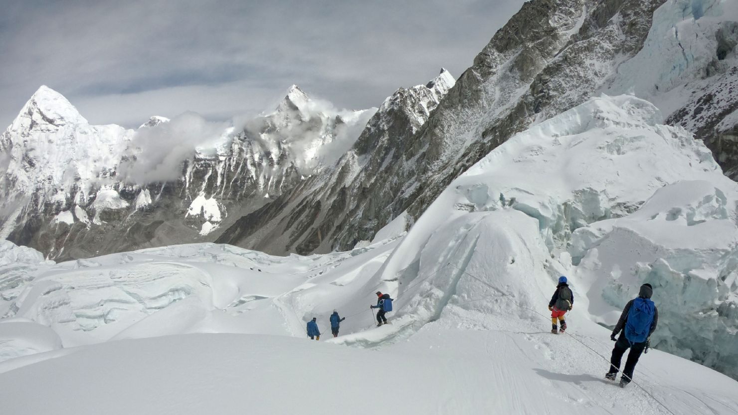 Mountaineers walk near camp on Mount Everest as they prepare to ascend In this photo from April 29, 2018.