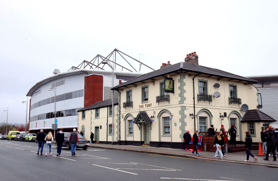 The Turf pub is a must-see for Wrexham fans. Here fans are pictured outside the venue ahead of an FA Cup tie in November 2022. 