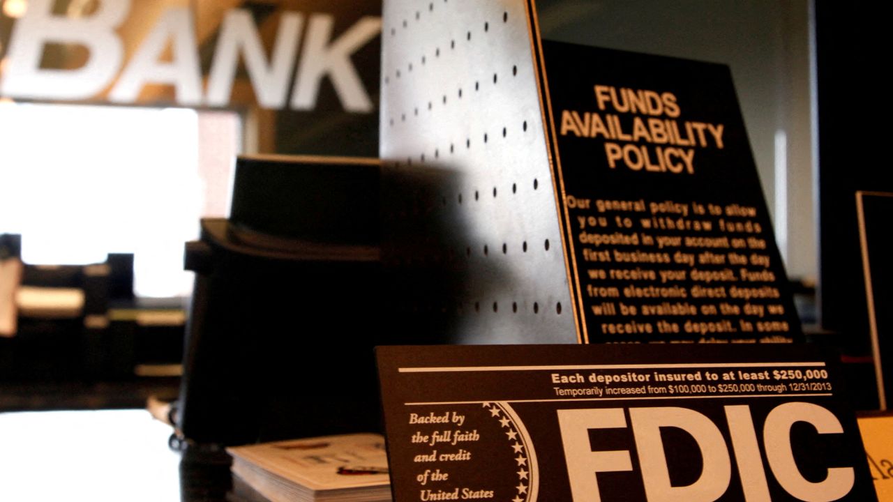Signs explaining the FDIC and banking policies on the counter of a bank in Colorado