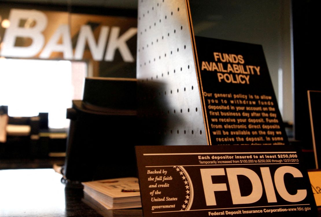 Signs explaining the FDIC and banking policies on the counter of a bank in Colorado