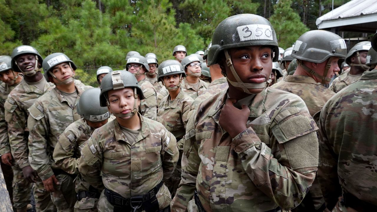 The US military is arguably the most integrated institution in the US. Army trainees, seen here, prepare to climb a rappelling tower during basic training.