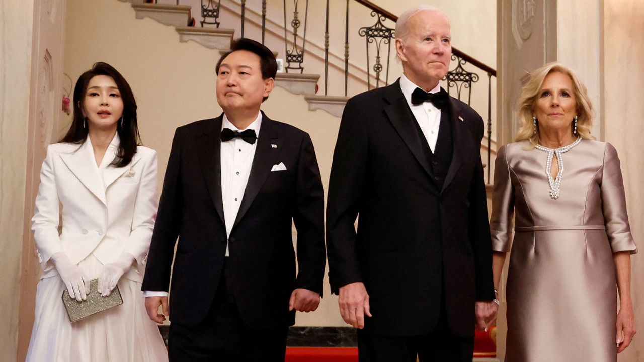 U.S. President Joe Biden and first lady Jill Biden pose with South Korea's President Yoon Suk Yeol and first lady Kim Keon Hee in front of the Grand Staircase of the White House before an official State Dinner, in Washington, U.S. April 26, 2023. REUTERS/Evelyn Hockstein