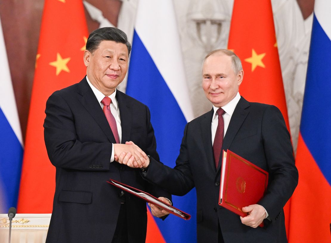 Chinese leader Xi Jinping and Russian President Vladimir Putin shake hands after signing a joint statement in Moscow on March 21, 2023. 