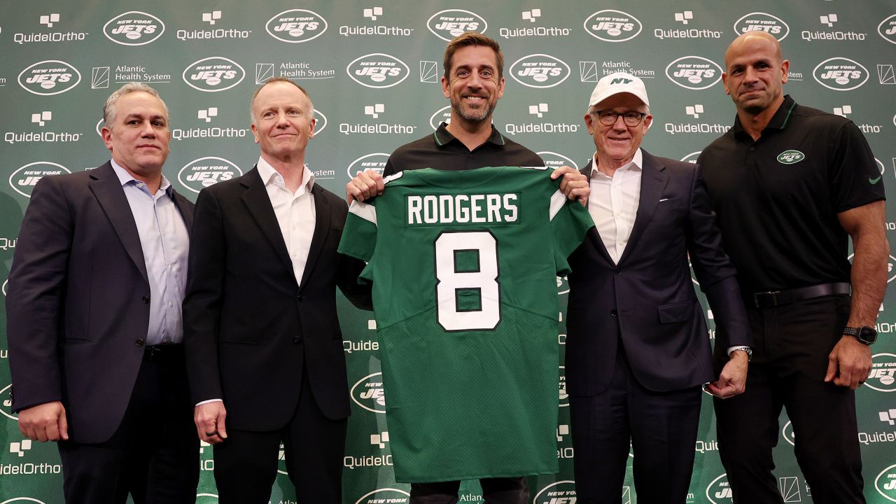 New York Jets team president Hymie Elhai, team owner Christopher Johnson, quarterback Aaron Rodgers, team owner Woody Johnson, and head coach Robert Saleh pose during the introductory press conference.