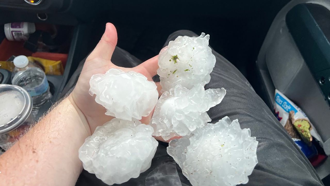 Storm chaser Matthew Waters was two miles east of Waco, Texas, on Wednesday when he took photos of hail measuring nearly 4 inches wide.