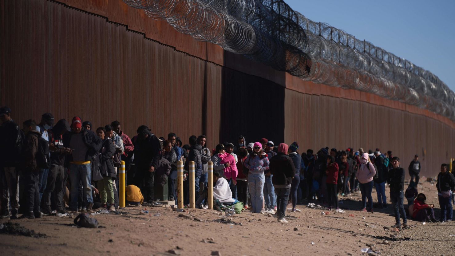 Hundreds of migrants line up to be processed by US Border Patrol after illegally entering the US in El Paso, Texas, on December 22, 2022.