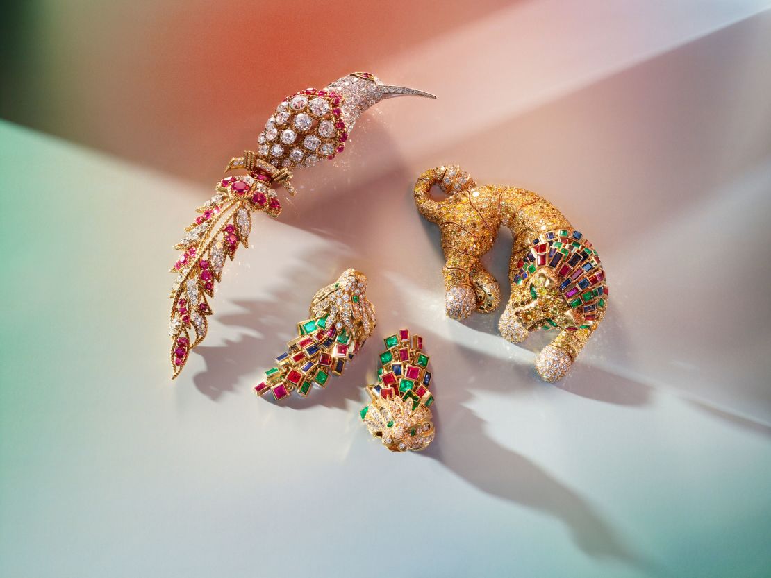Van Cleef & Arpels ruby and diamond "Bird of Paradise" brooch, and a René Boivin multi-gem lion brooch and unsigned lionhead earrings.