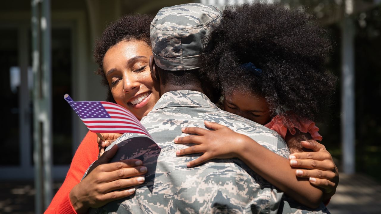 military spouse family hug STOCK