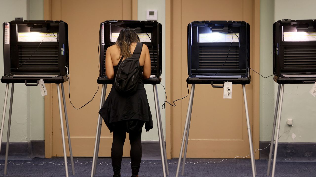 A Florida voter fills out an election ballot at a polling station in Miami on November 2, 2021.