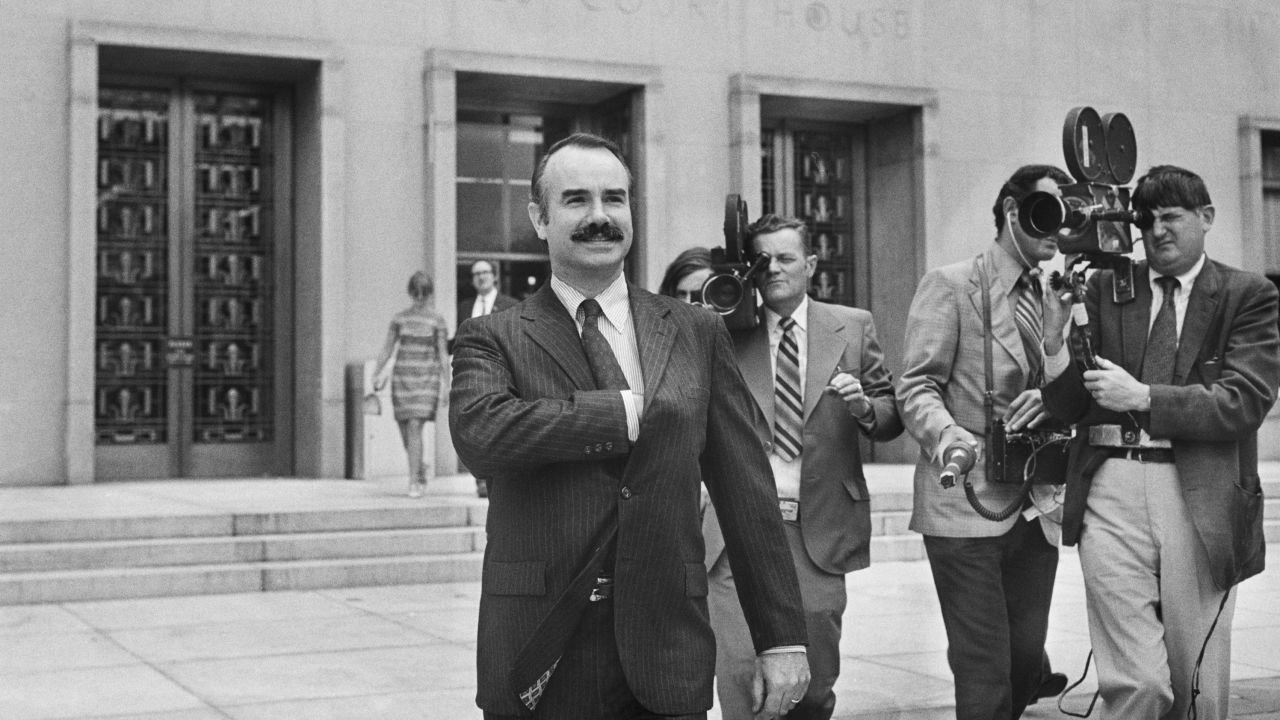 Former White House aide G. Gordon Liddy leaving the US District Court during his trial for the Watergate break-in.