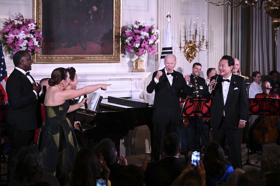 US President Joe Biden joins South Korean President Yoon Suk Yeol on stage during a <a href="https://www.cnn.com/2023/04/27/politics/state-dinner-south-korean-president/index.html" target="_blank">state dinner</a> that was held at the White House on Wednesday, April 26. Following a round of musical performances, Yoon performed his own rendition of Don McLean's "American Pie," which received a standing ovation from the crowd.