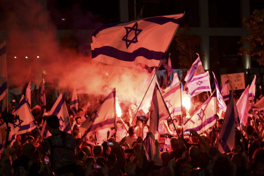 Demonstrators light flares during a rally in Tel Aviv, Israel, protesting the Israeli government's judicial overhaul bill on Tuesday, April 25. For months, Israelis have been <a href="https://www.cnn.com/2023/03/27/middleeast/gallery/israel-judicial-reform-protests/index.html" target="_blank">taking to the streets</a> to propose the proposed changes to the country's legal system.
