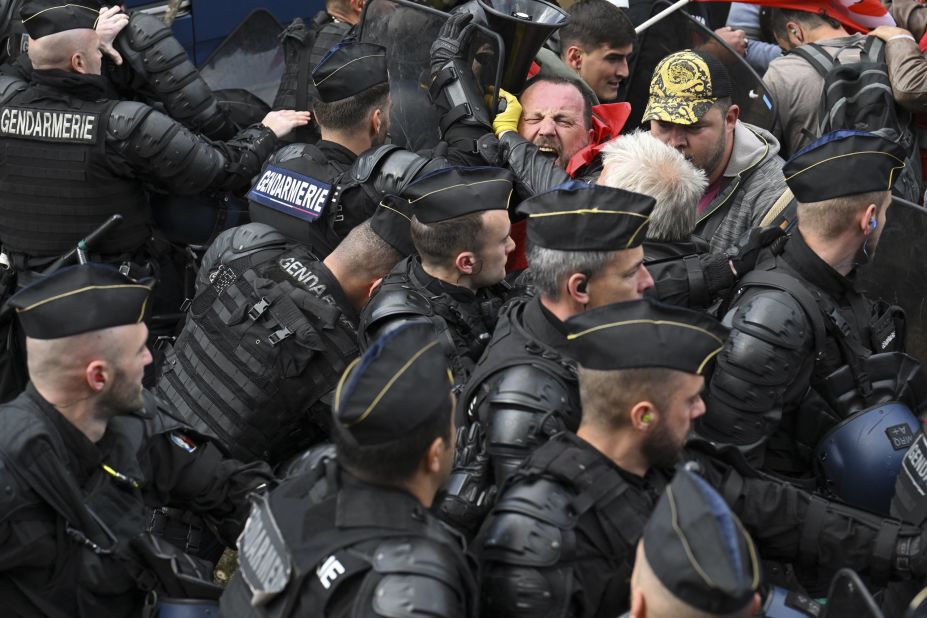 Protesters scuffle with police in La Cluse-et-Mijoux, France, on Thursday, April 27. For weeks, people in France have been <a href="https://www.cnn.com/2023/03/23/business/france-national-strike-pension-reform/index.html" target="_blank">protesting a retirement-age increase</a> that was pushed through parliament without a vote.