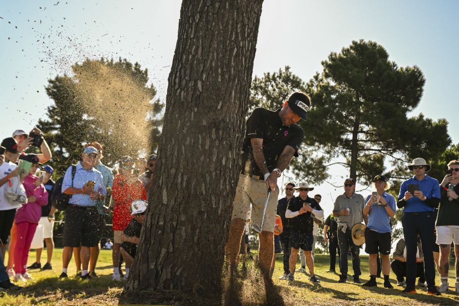 Bubba Watson plays a shot from behind a tree during a LIV Golf event in Adelaide, Australia, on Friday, April 21.