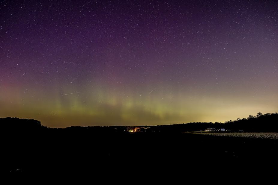The aurora borealis, also known as the northern lights, can be seen from a road in Bloomington, Indiana, on Sunday, April 23. In recent months, photographers and night sky watchers <a href="https://www.cnn.com/2023/04/24/world/aurora-northern-southern-lights-explainer-scn/index.html" target="_blank">have been capturing the colorful display further south than usual</a> (or north if you're in the southern hemisphere). <a href="http://www.cnn.com/2023/04/20/world/gallery/photos-this-week-april-13-april-20-ctrp/index.html" target="_blank">See last week in 35 photos</a>.