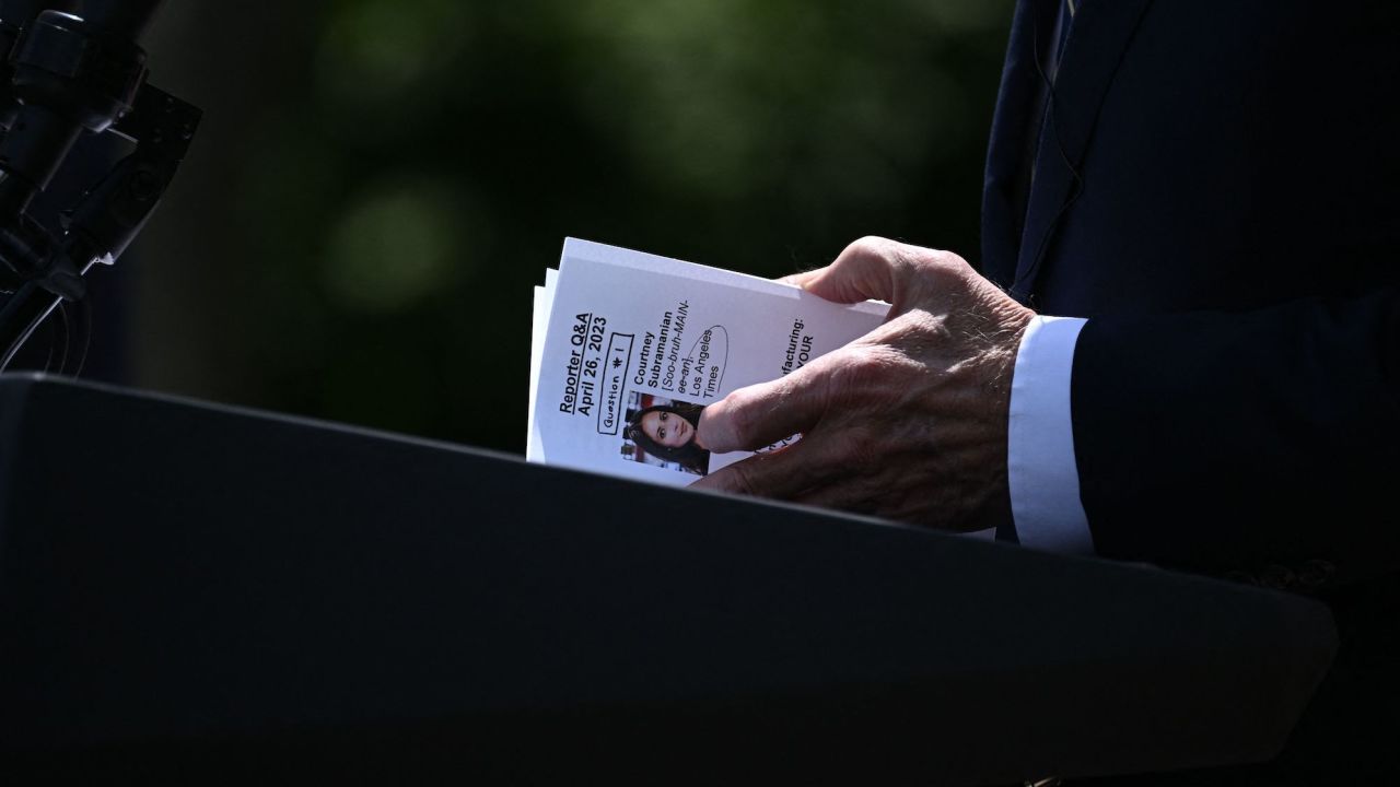President Joe Biden looks at a note card referencing a reporter and a question during a news conference in the Rose Garden on April 26, 2023. 