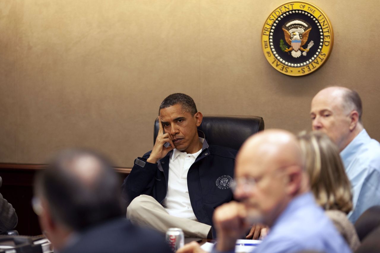 Obama listens as his national security team discusses the raid.