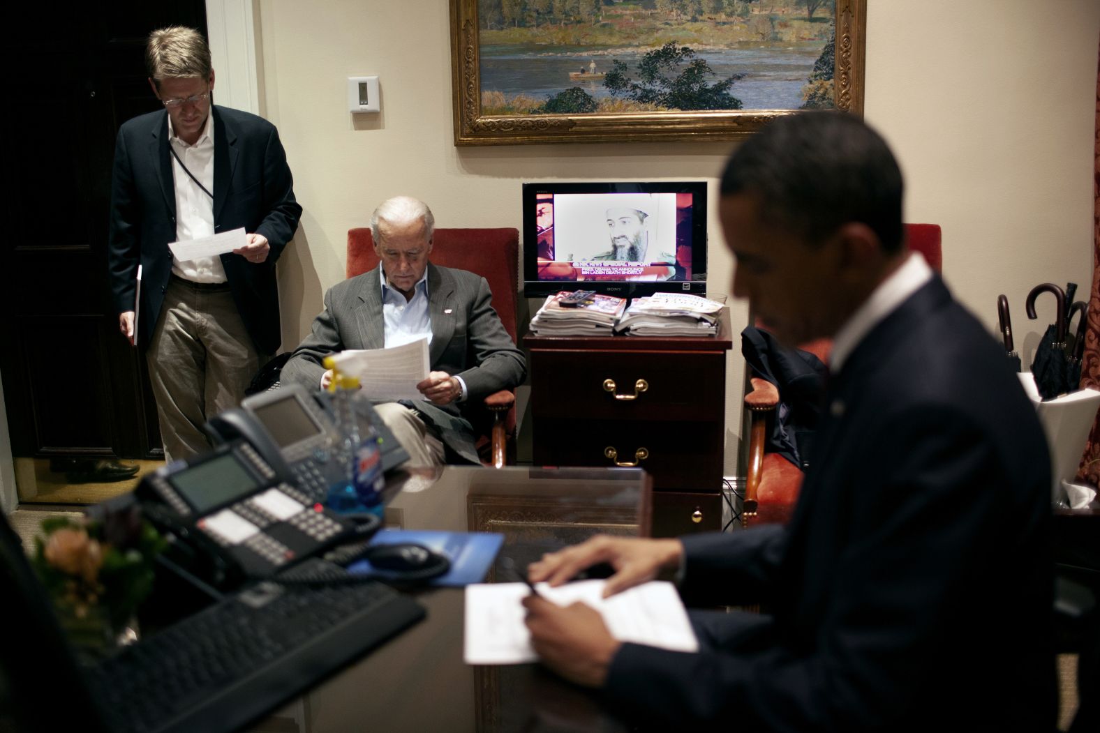 Biden and White House press secretary Jay Carney, left, review Obama's remarks.