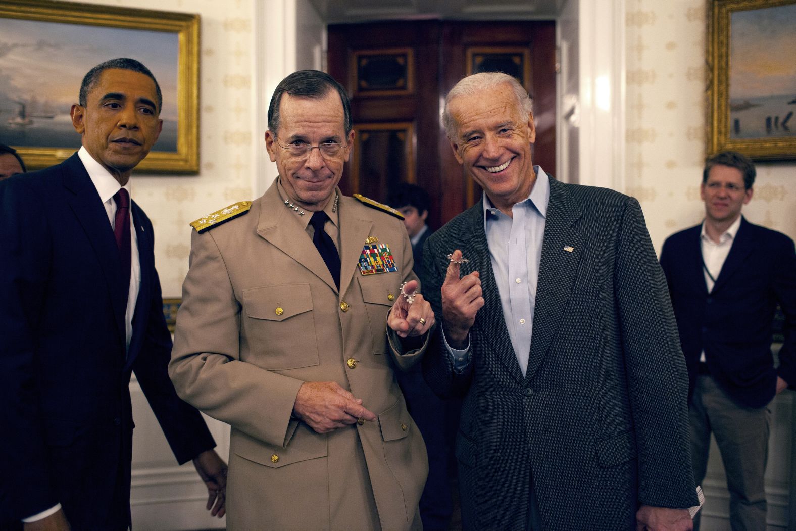 Chairman of the Joint Chiefs of Staff Adm. Mike Mullen celebrates with Biden following the mission.