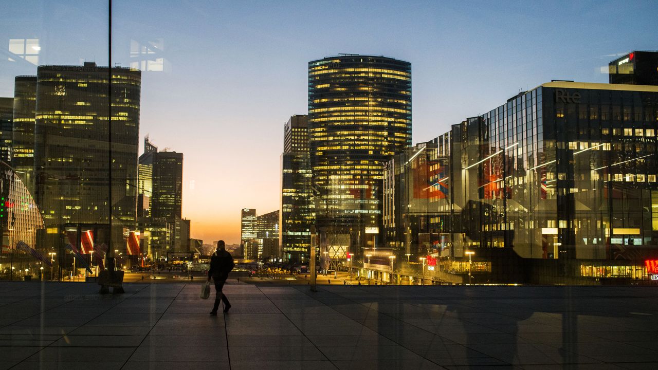 Office buildings illuminated in the La Defense business district of Paris, France, on Monday, Feb. 6, 2023.