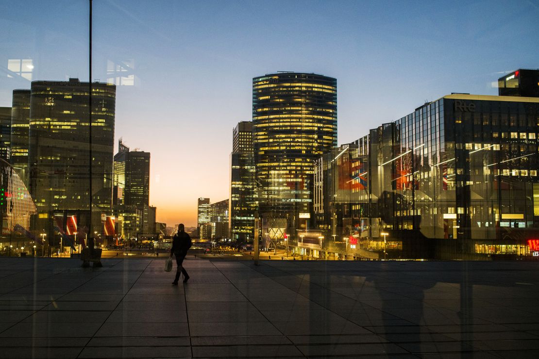 Office buildings illuminated in the La Defense business district of Paris, France, on Monday, Feb. 6, 2023. 