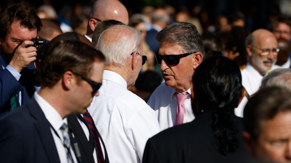 Biden speaks to Manchin during an Inflation Reduction Act event on the South Lawn of the White House in September 2022.