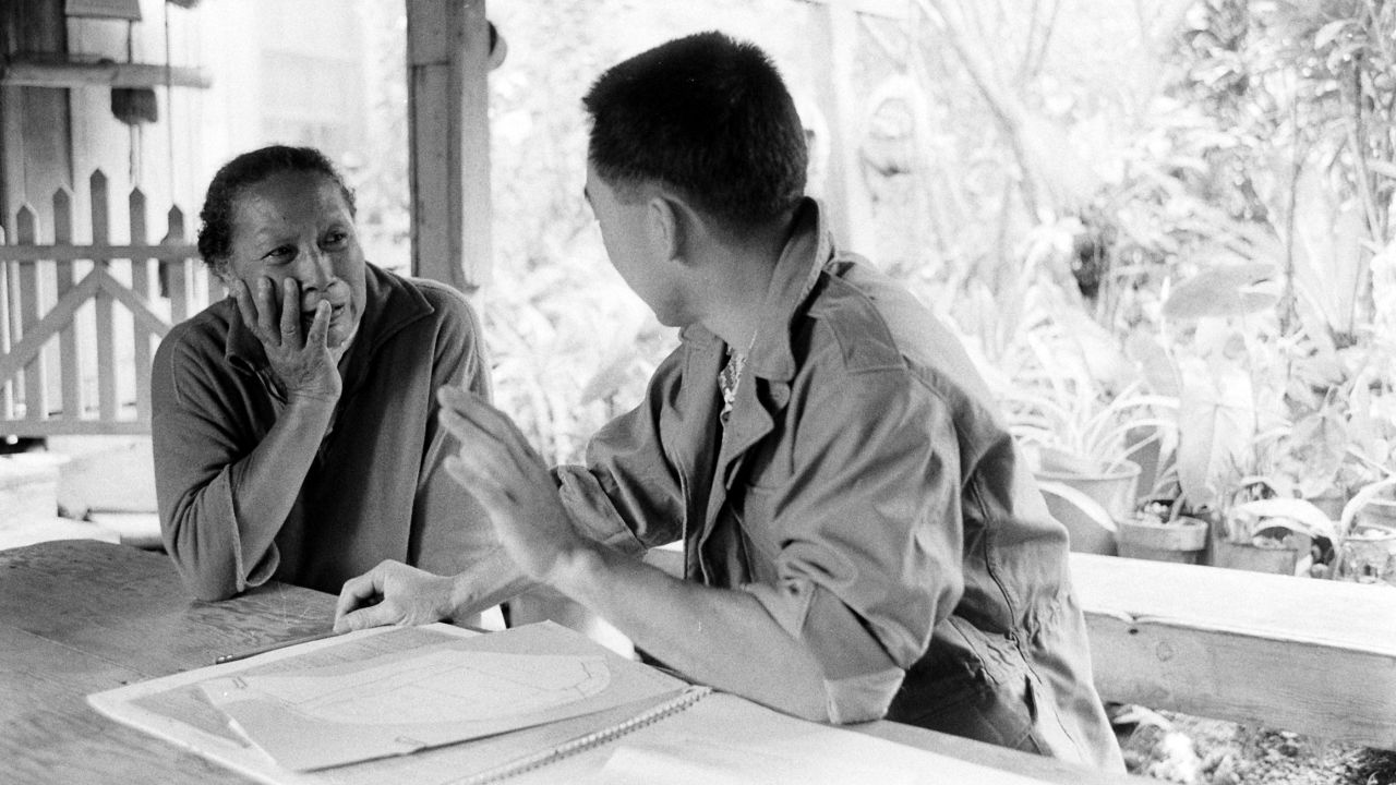 A census taker (right) interviews a resident in Honolulu, Hawaii, March 1960.