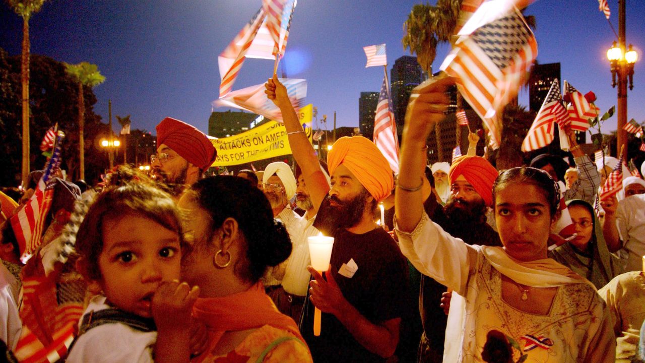 Sikhs in Los Angeles wave American flags during a memorial for the 9/11 victims. Several Sikhs were targeted in the days after the attacks as some wrongly associated their turbans with terrorists.