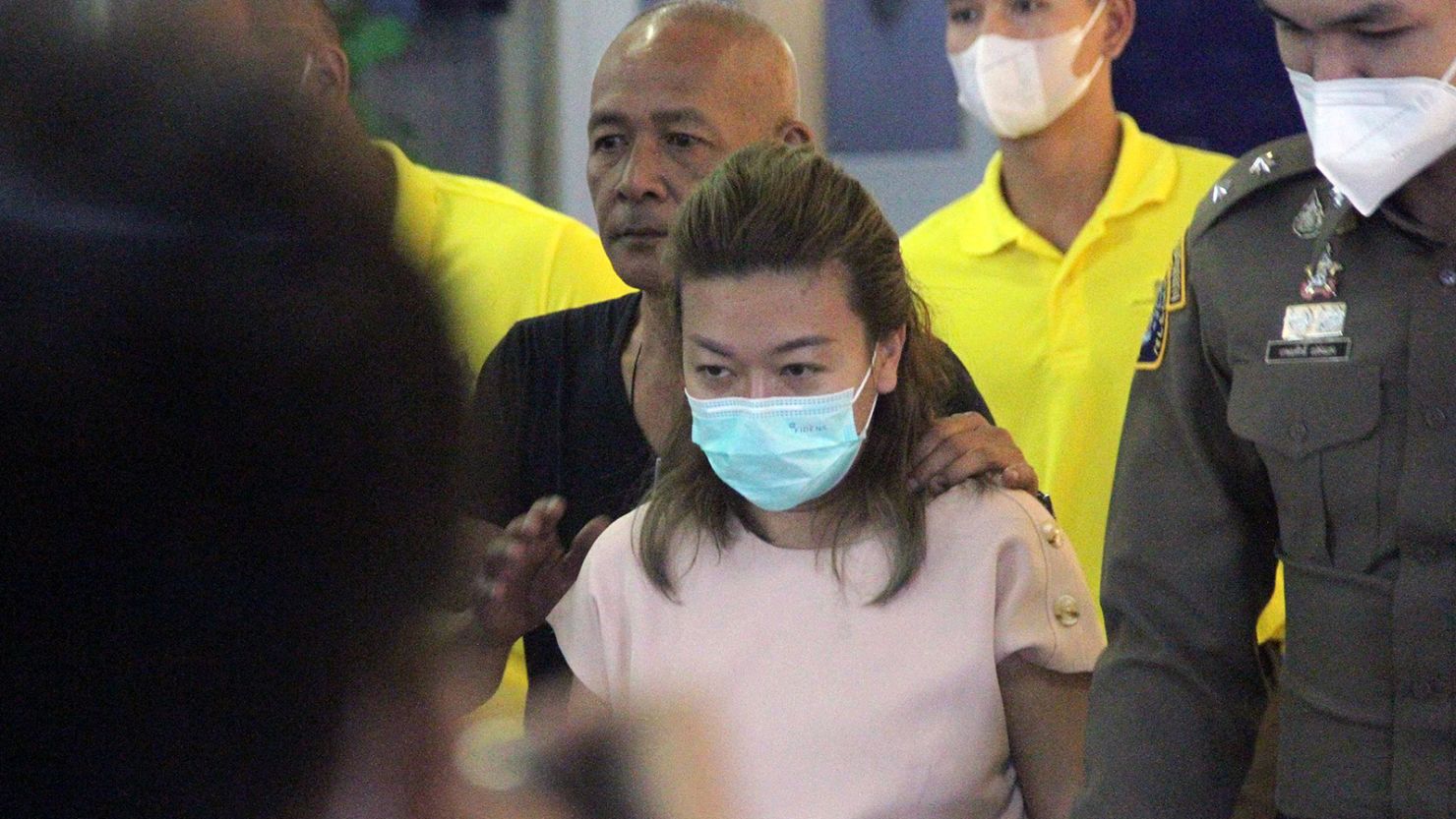 The woman accused of killing at least 12  people with cyanide appeared in Bangkok's criminal court after her arrest Tuesday. 