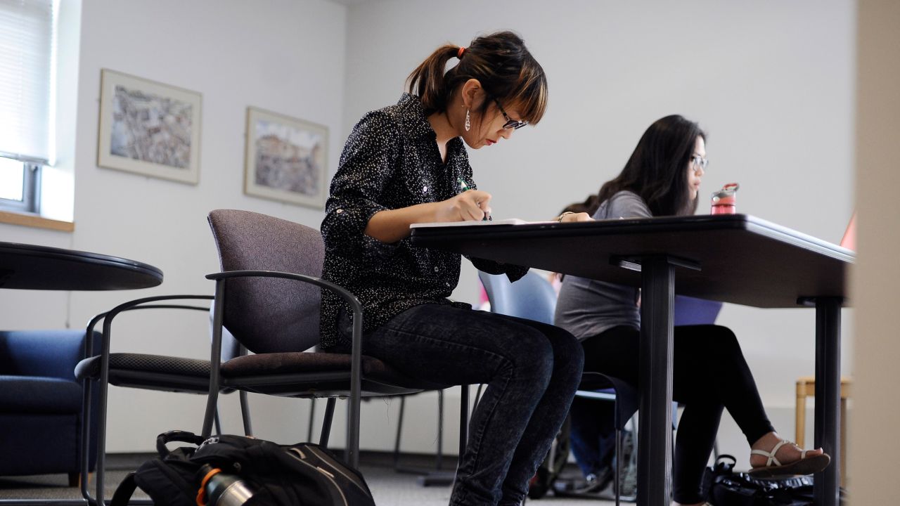 Calliope Wong, in this 2014 photo, studies before class at the University of Connecticut, where she enrolled after being denied admission to Smith College. 