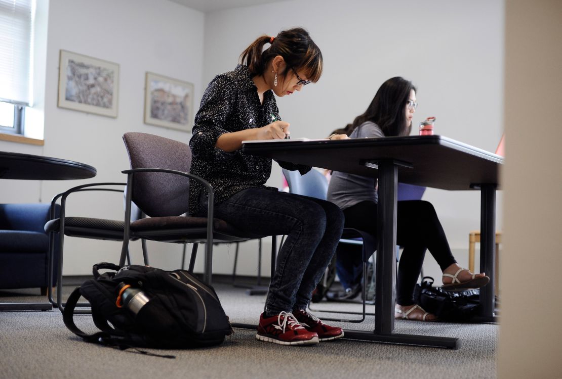 Calliope Wong, in this 2014 photo, studies before class at the University of Connecticut, where she enrolled after being denied admission to Smith College. 