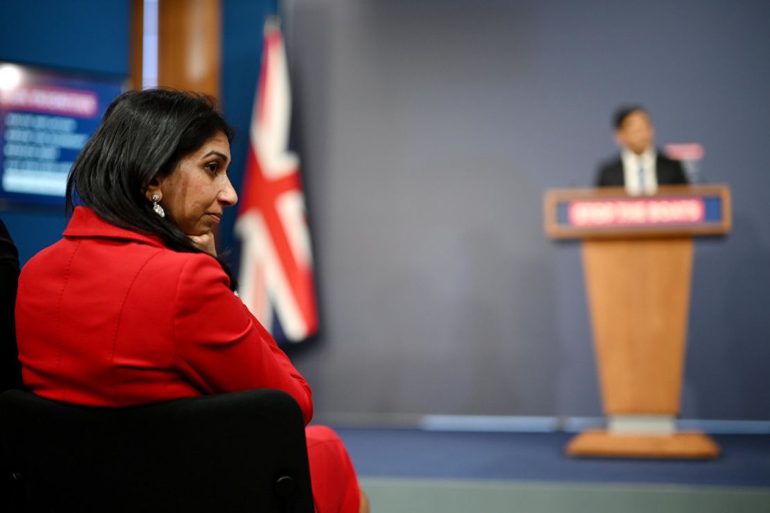 LONDON, ENGLAND - MARCH 07: Home Secretary Suella Braverman listens as Prime Minister Rishi Sunak speaks during a press conference following the launch of new legislation on migrant channel crossings at Downing Street on March 7, 2023 in London, United Kingdom. The new plan will ban refugees arriving in the UK by small boats from today from claiming asylum. Home Secretary Suella Braverman has said the new legislation "pushes the boundaries of international law". (Photo by Leon Neal/Getty Images)