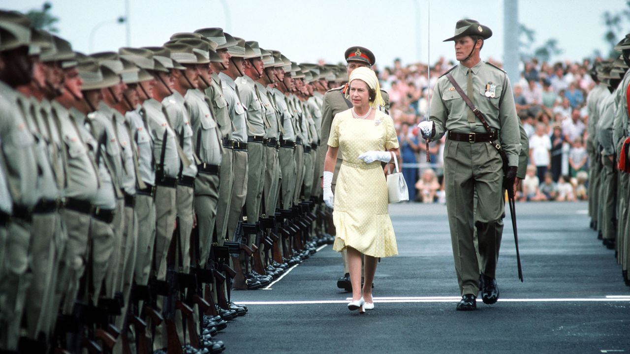 Queen Elizabeth II reviews troops in Brisbane, Australia, during her 1977 Jubilee tour.
