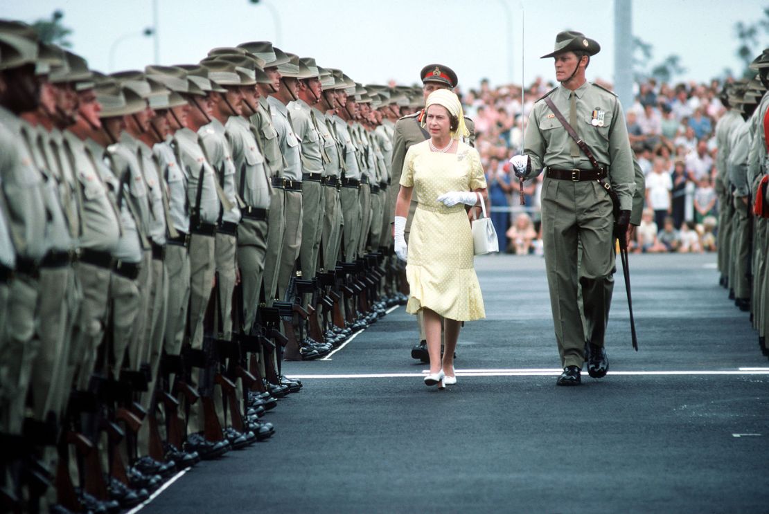 Queen Elizabeth II reviews troops in Brisbane, Australia, during her 1977 Jubilee tour.
