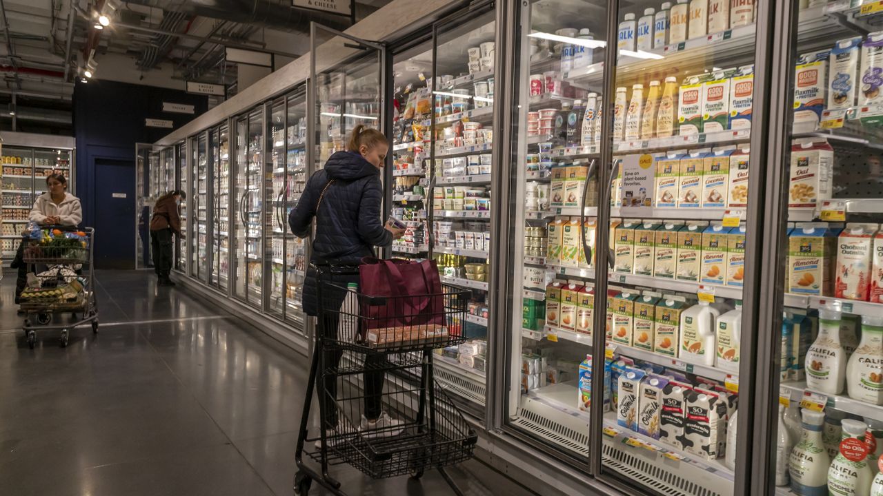 Shopping in a Whole Foods Market supermarket in New York on Thursday, April 27, 2023.