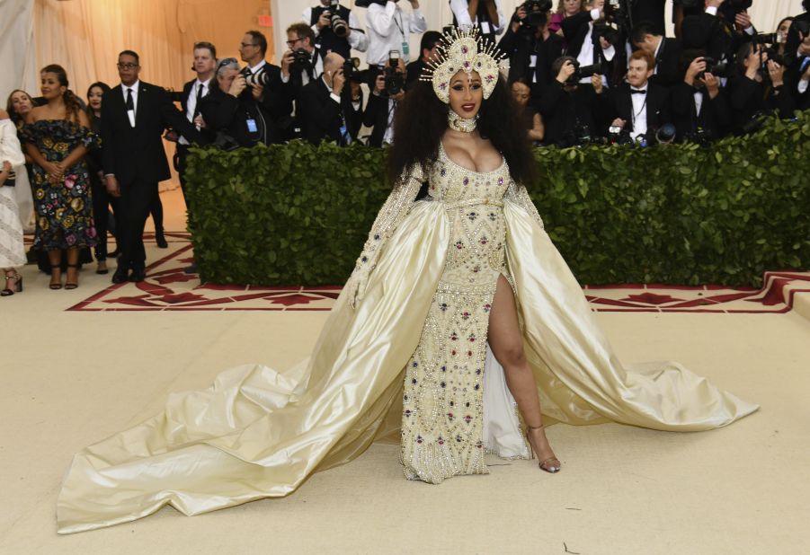 A pearl-covered Cardi B attends the Met Gala on May 7, 2018 in custom Moschino to celebrate the Costume Institute's exhibition "Heavenly Bodies: Fashion and the Catholic Imagination.''