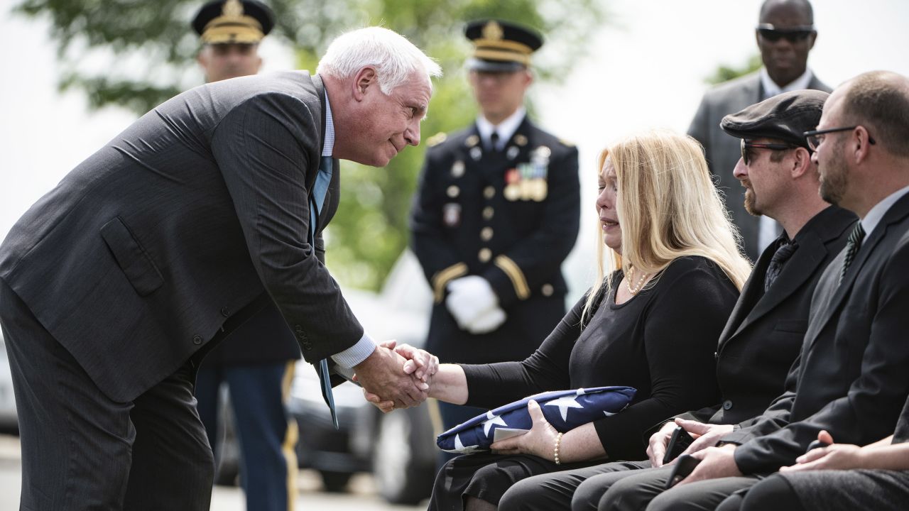 Charles Alexander Jr., superintendent at Arlington, offers condolences to Rachel Bender.