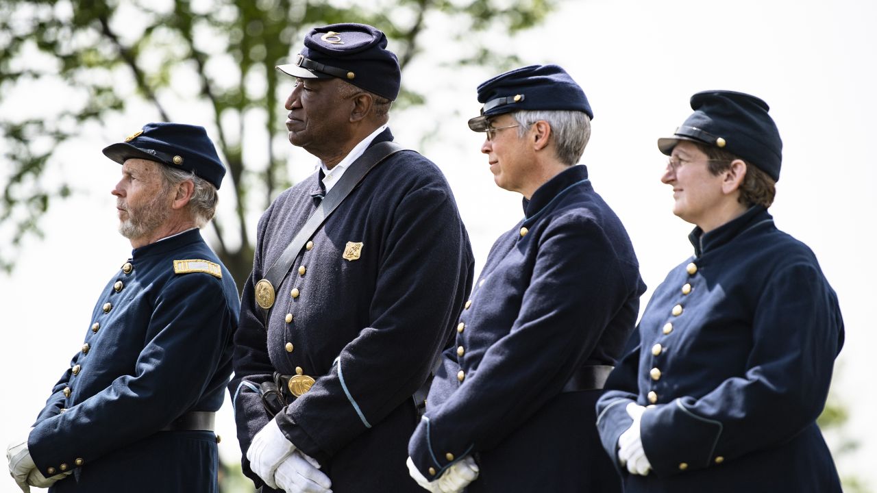 Federal reenactors attend Thursday morning's burial at Arlington National Cemetery.